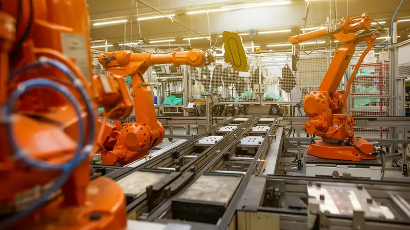 An industrial robot arm in a work cell